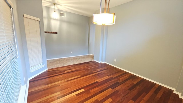 12828 Withers Way, Austin, TX 78727 - empty room featuring wood finished floors and baseboards