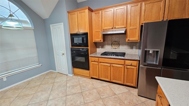 12828 Withers Way, Austin, TX 78727 - kitchen with black appliances, backsplash, under cabinet range hood, lofted ceiling, and light stone countertops