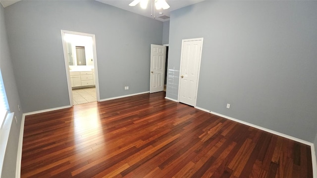 12828 Withers Way, Austin, TX 78727 - unfurnished bedroom with wood finished floors, ceiling fan, and ensuite bathroom