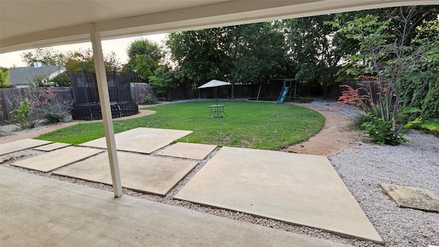 12828 Withers Way, Austin, TX 78727 - fenced backyard featuring a playground, a trampoline, and a patio area