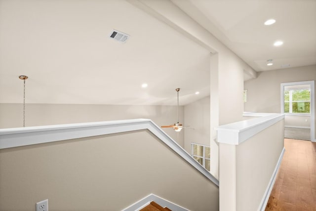 8945 Parker Ranch Cir Unit B, Austin, TX 78748 - hallway with an upstairs landing, hardwood / wood-style floors, recessed lighting, baseboards, and lofted ceiling