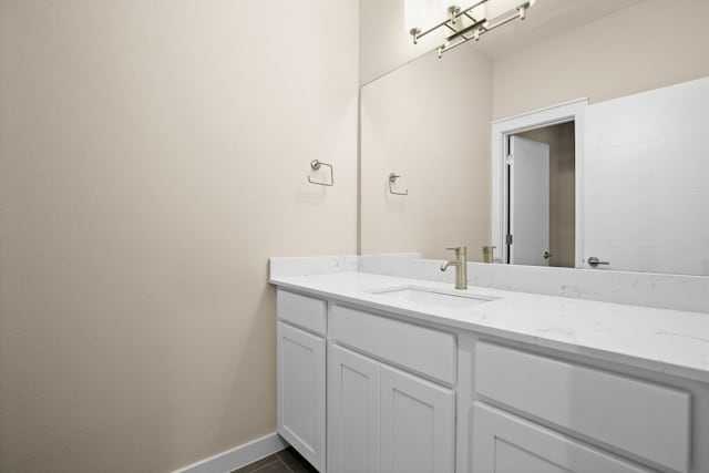 8945 Parker Ranch Cir Unit B, Austin, TX 78748 - bathroom with vanity and baseboards