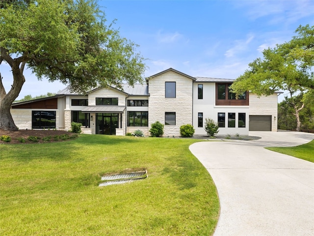 6037 Verandero Ct, Austin, TX 78738 - view of front facade with a standing seam roof, stone siding, concrete driveway, an attached garage, and metal roof