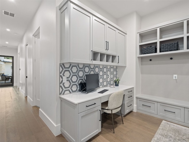 6037 Verandero Ct, Austin, TX 78738 - office area featuring built in desk, light wood-style flooring, and recessed lighting