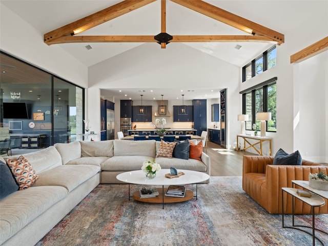 6037 Verandero Ct, Austin, TX 78738 - living area with high vaulted ceiling, wood finished floors, and beam ceiling