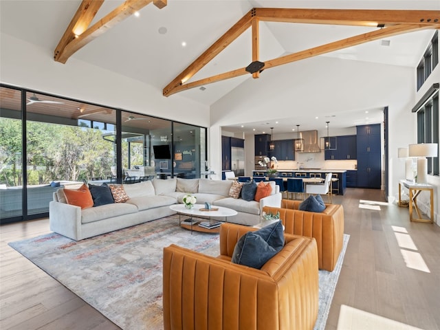 6037 Verandero Ct, Austin, TX 78738 - living area with high vaulted ceiling, beamed ceiling, and light wood-style flooring
