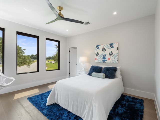 6037 Verandero Ct, Austin, TX 78738 - bedroom featuring multiple windows, wood finished floors, baseboards, recessed lighting, and ceiling fan
