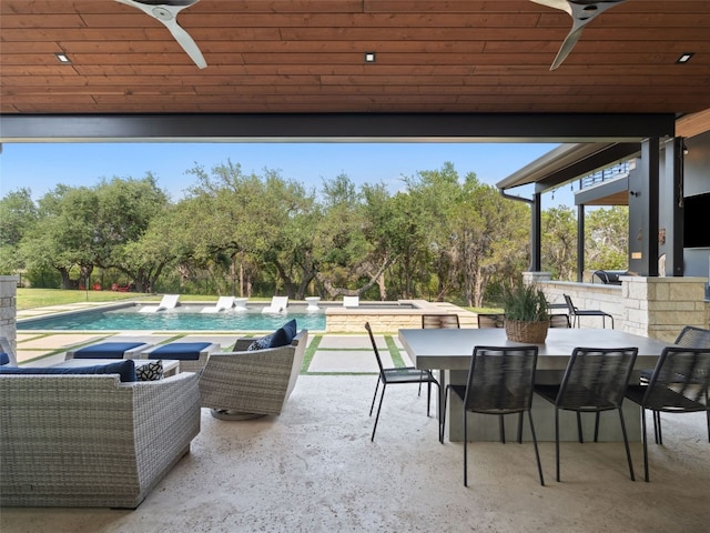 6037 Verandero Ct, Austin, TX 78738 - view of patio / terrace featuring a ceiling fan, outdoor dining space, an outdoor pool, and view of wooded area