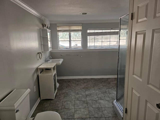 1407 Wilshire Blvd, Austin, TX 78722 - full bathroom with baseboards, vanity, ornamental molding, toilet, and a stall shower