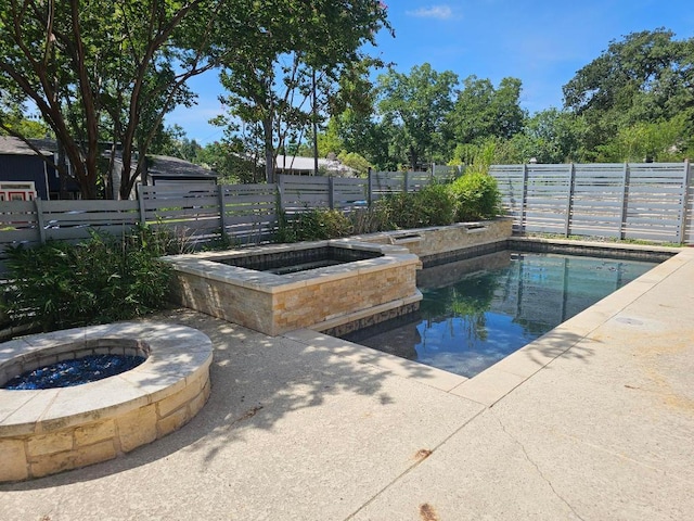 1407 Wilshire Blvd, Austin, TX 78722 - view of pool featuring an outdoor fire pit, a fenced backyard, a patio area, and a pool with connected hot tub