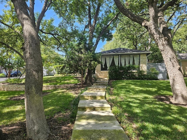 1407 Wilshire Blvd, Austin, TX 78722 - view of front of home with a front yard and stone siding