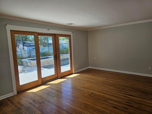 1407 Wilshire Blvd, Austin, TX 78722 - spare room with healthy amount of natural light, dark wood-style floors, crown molding, and baseboards