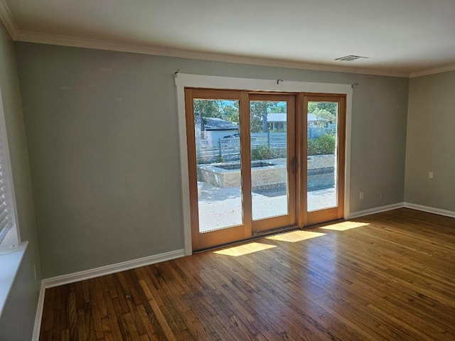 1407 Wilshire Blvd, Austin, TX 78722 - empty room with wood-type flooring, baseboards, and crown molding