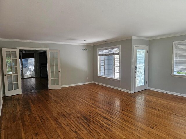 1407 Wilshire Blvd, Austin, TX 78722 - empty room with wood-type flooring, baseboards, crown molding, and french doors