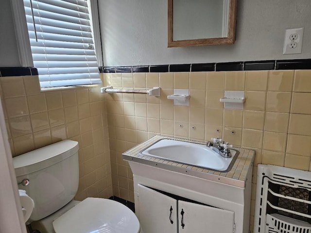 1407 Wilshire Blvd, Austin, TX 78722 - bathroom featuring tile walls, vanity, and toilet