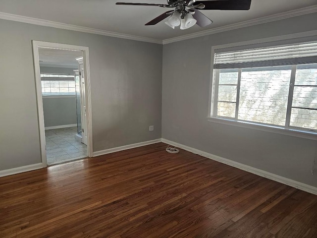 1407 Wilshire Blvd, Austin, TX 78722 - spare room featuring a ceiling fan, ornamental molding, wood finished floors, and baseboards
