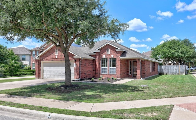 2801 Stirrup Cv, Leander, TX 78641 - view of front of home with a garage, brick siding, concrete driveway, and a shingled roof