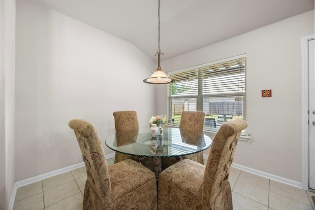 2801 Stirrup Cv, Leander, TX 78641 - dining space featuring light tile patterned flooring, baseboards, and lofted ceiling