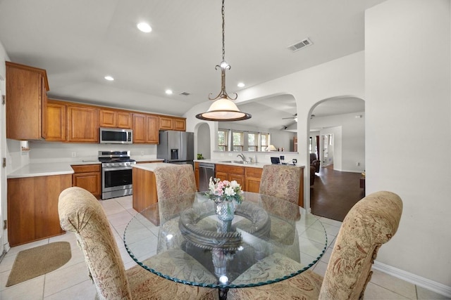 2801 Stirrup Cv, Leander, TX 78641 - dining area with arched walkways, recessed lighting, baseboards, and light tile patterned flooring