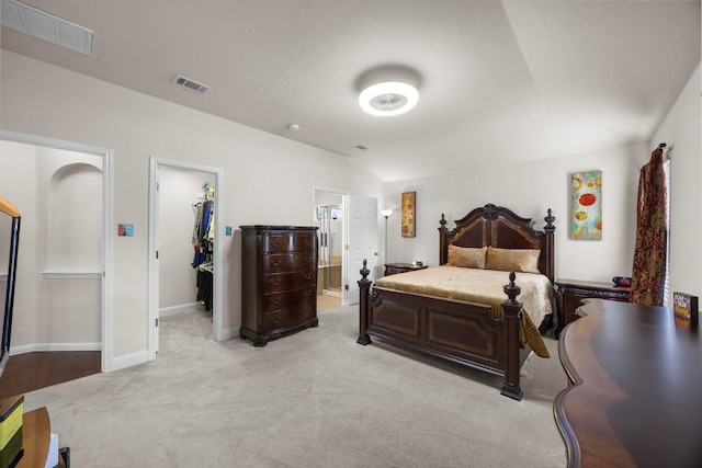 2801 Stirrup Cv, Leander, TX 78641 - carpeted bedroom with a spacious closet, baseboards, ensuite bathroom, and a closet