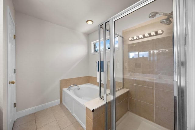 2801 Stirrup Cv, Leander, TX 78641 - full bathroom with a stall shower, a bath, tile patterned floors, and baseboards