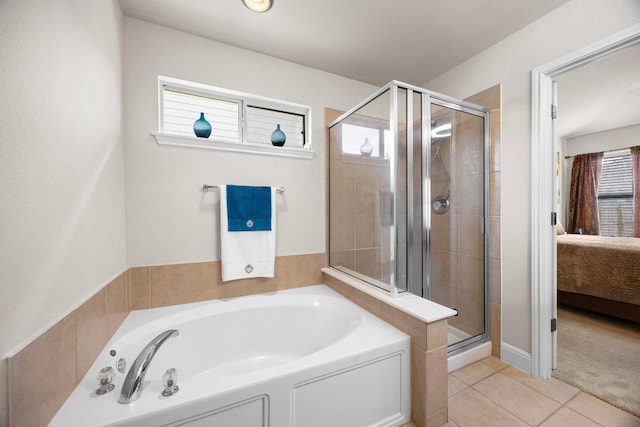 2801 Stirrup Cv, Leander, TX 78641 - ensuite bathroom featuring a bath, a stall shower, and tile patterned flooring