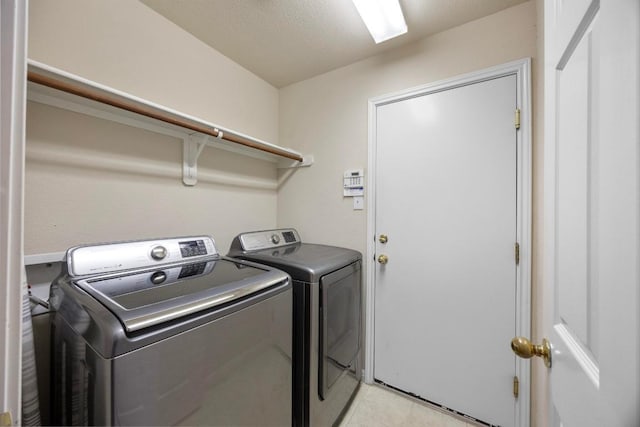 2801 Stirrup Cv, Leander, TX 78641 - washroom with independent washer and dryer and light tile patterned flooring