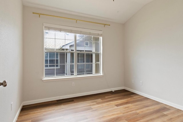 1900 Scofield Ridge Parkway Unit 1703, Austin, TX 78727 - unfurnished room with light wood-style flooring, lofted ceiling, and baseboards
