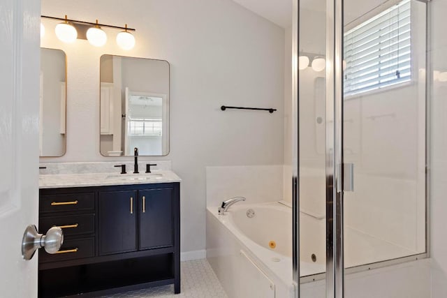 1900 Scofield Ridge Parkway Unit 1703, Austin, TX 78727 - bathroom with vanity, a jetted tub, and a stall shower