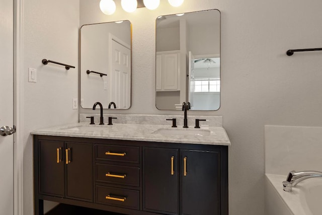 1900 Scofield Ridge Parkway Unit 1703, Austin, TX 78727 - bathroom with double vanity and a tub to relax in