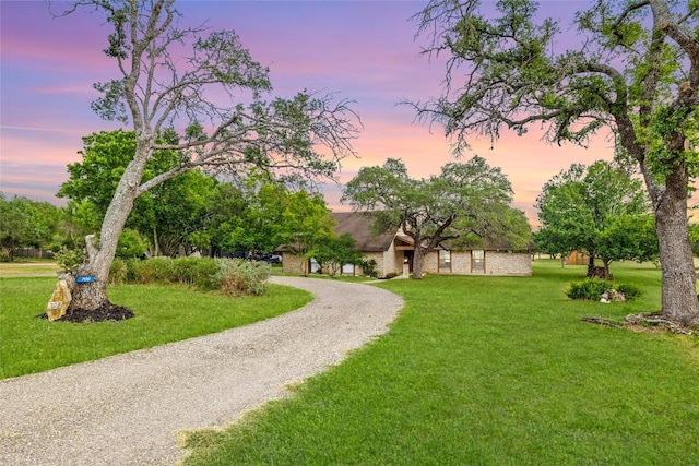 708 Post Oak Dr, Dripping Springs, TX 78620 - view of front facade with a lawn and gravel driveway
