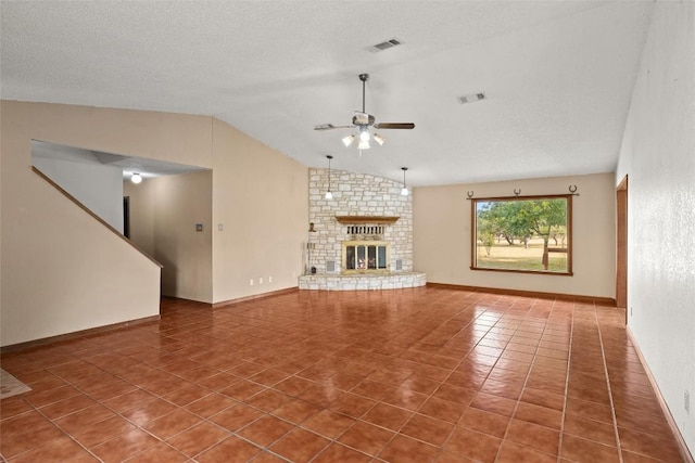 708 Post Oak Dr, Dripping Springs, TX 78620 - unfurnished living room featuring a ceiling fan, tile patterned floors, vaulted ceiling, a brick fireplace, and baseboards