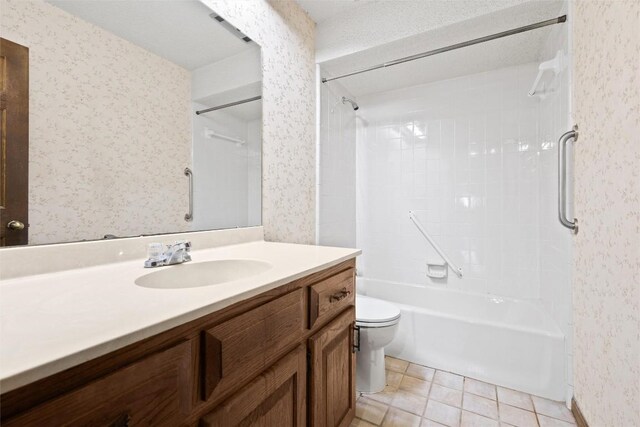 708 Post Oak Dr, Dripping Springs, TX 78620 - bathroom featuring wallpapered walls, vanity, toilet, bathtub / shower combination, and tile patterned floors