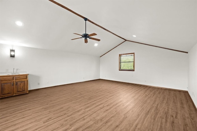 708 Post Oak Dr, Dripping Springs, TX 78620 - additional living space featuring light wood finished floors, ceiling fan, a sink, vaulted ceiling, and baseboards