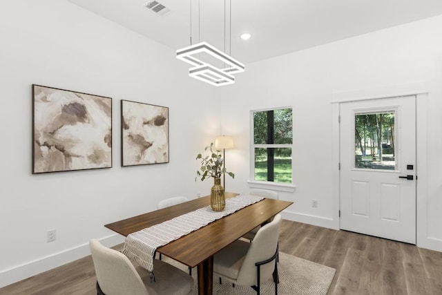 147 Puu Waa Waa Ln, Bastrop, TX 78602 - dining room with wood finished floors, a chandelier, and recessed lighting