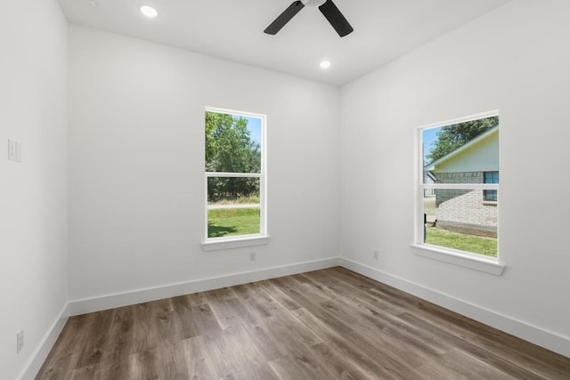 147 Puu Waa Waa Ln, Bastrop, TX 78602 - spare room featuring healthy amount of natural light, wood finished floors, a ceiling fan, and recessed lighting