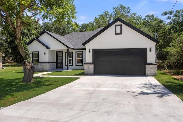147 Puu Waa Waa Ln, Bastrop, TX 78602 - modern farmhouse featuring stucco siding, stone siding, a garage, a front yard, and driveway