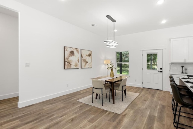 147 Puu Waa Waa Ln, Bastrop, TX 78602 - dining space with light wood finished floors and recessed lighting