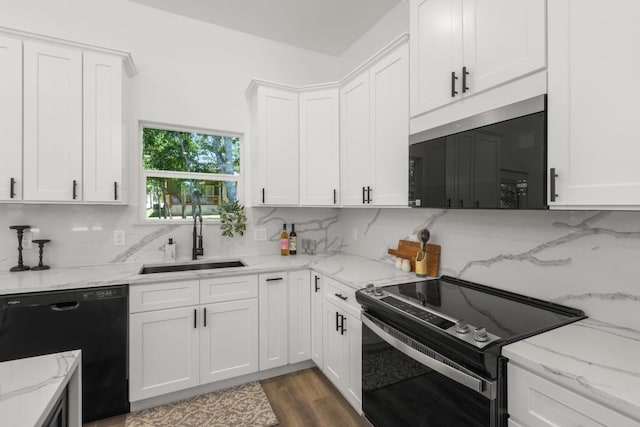 147 Puu Waa Waa Ln, Bastrop, TX 78602 - kitchen featuring electric range, stainless steel microwave, dishwasher, and white cabinetry