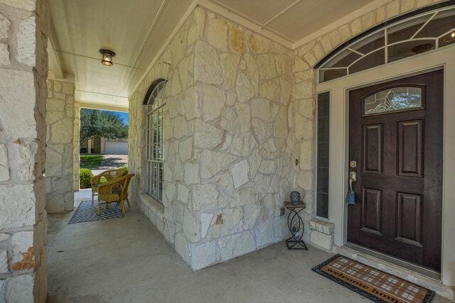 14800 Banbridge Trl, Austin, TX 78717 - entrance to property featuring covered porch and stone siding