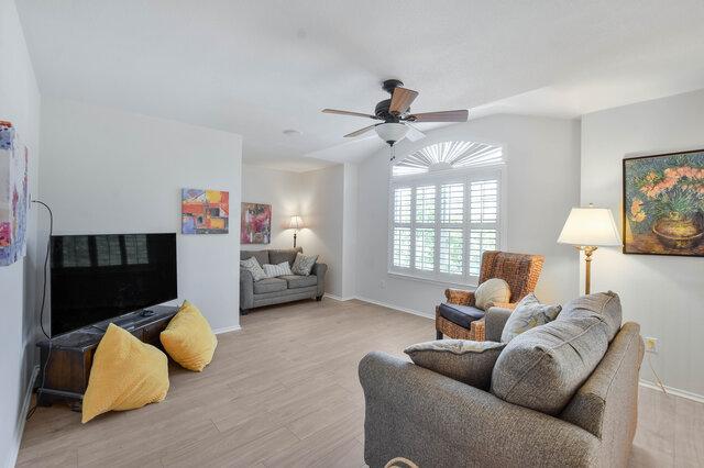 14800 Banbridge Trl, Austin, TX 78717 - living area featuring ceiling fan, wood finished floors, and baseboards