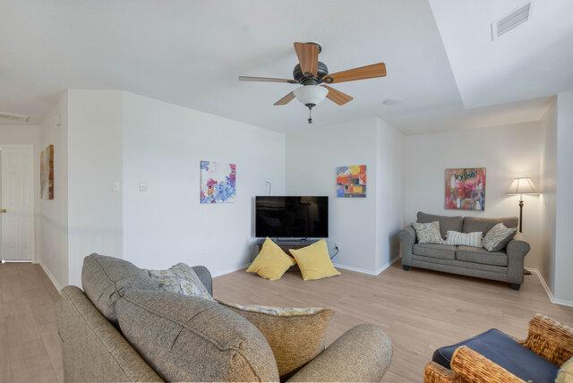14800 Banbridge Trl, Austin, TX 78717 - living area featuring wood finished floors, a ceiling fan, and baseboards