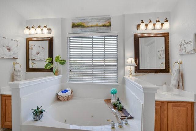 14800 Banbridge Trl, Austin, TX 78717 - bathroom with a whirlpool tub and vanity