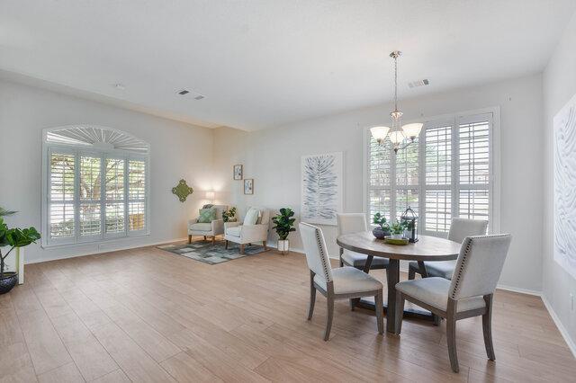 14800 Banbridge Trl, Austin, TX 78717 - dining space featuring a chandelier, plenty of natural light, and light wood-style flooring