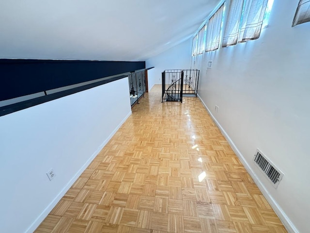 11804 Buckingham Rd, Austin, TX 78759 - corridor with an upstairs landing, baseboards, and lofted ceiling