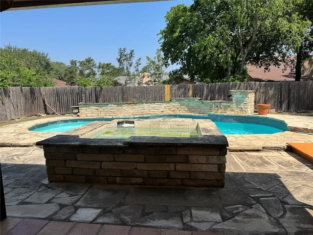 11804 Buckingham Rd, Austin, TX 78759 - view of pool with a fenced backyard, a patio area, and a pool with connected hot tub