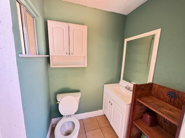 11804 Buckingham Rd, Austin, TX 78759 - half bathroom with toilet, vanity, baseboards, and tile patterned floors