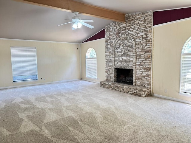 11804 Buckingham Rd, Austin, TX 78759 - unfurnished living room featuring ceiling fan, carpet flooring, a stone fireplace, and baseboards