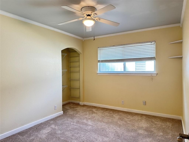 11804 Buckingham Rd, Austin, TX 78759 - carpeted spare room with ceiling fan, ornamental molding, arched walkways, and baseboards