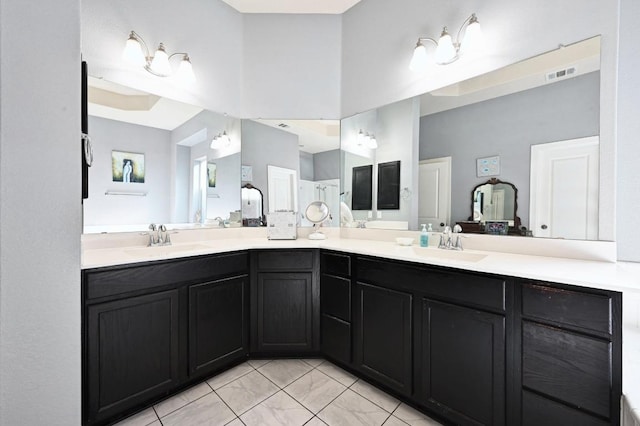 411 Torrington Dr, Austin, TX 78737 - bathroom with double vanity, marble finish flooring, and a towering ceiling